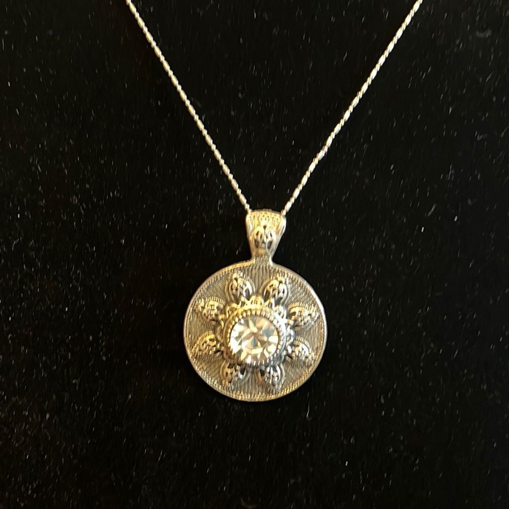 Handcrafted antique looking pendant on a 18 inch silver tone chain
